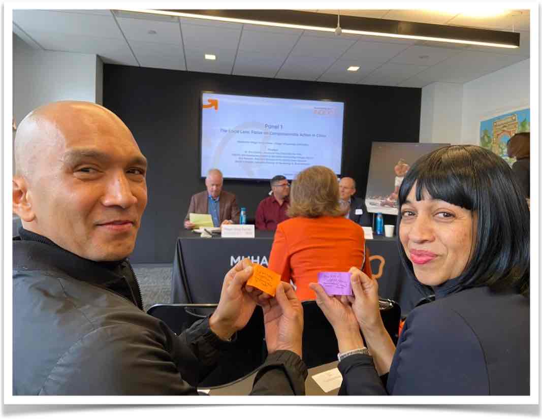 People holding love notes at a conference