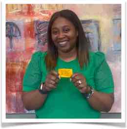 Person holding yellow love note